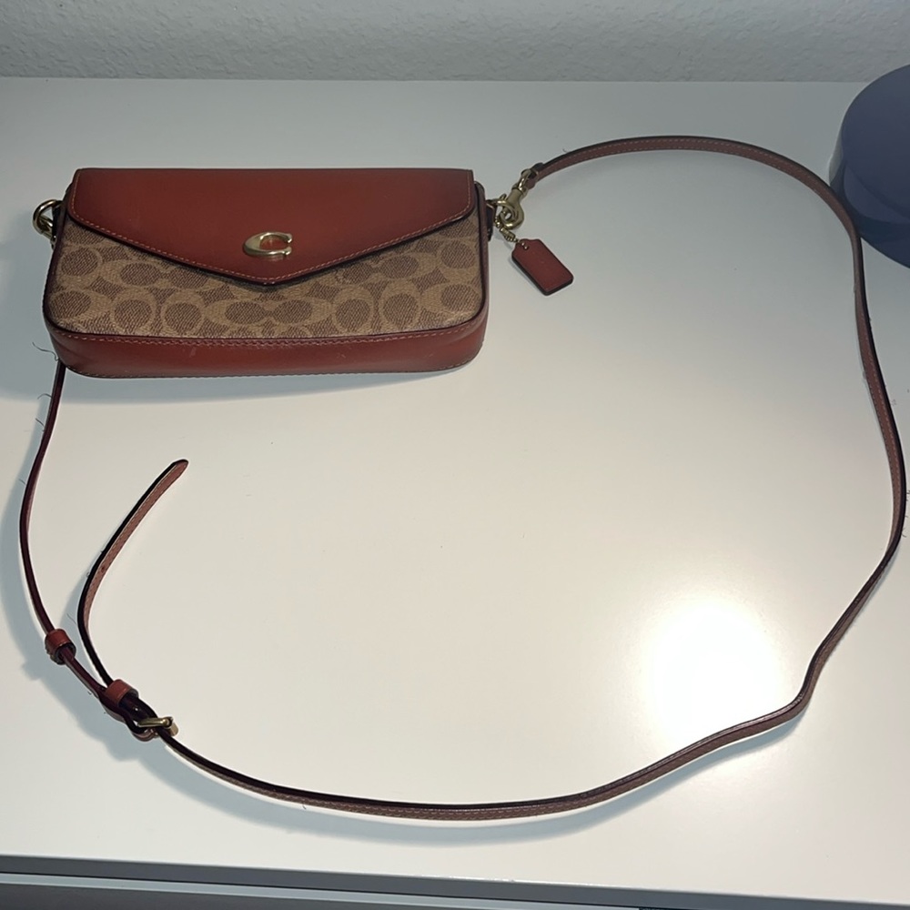 Coach Wyn signature coated canvas & leather crossbody bag.